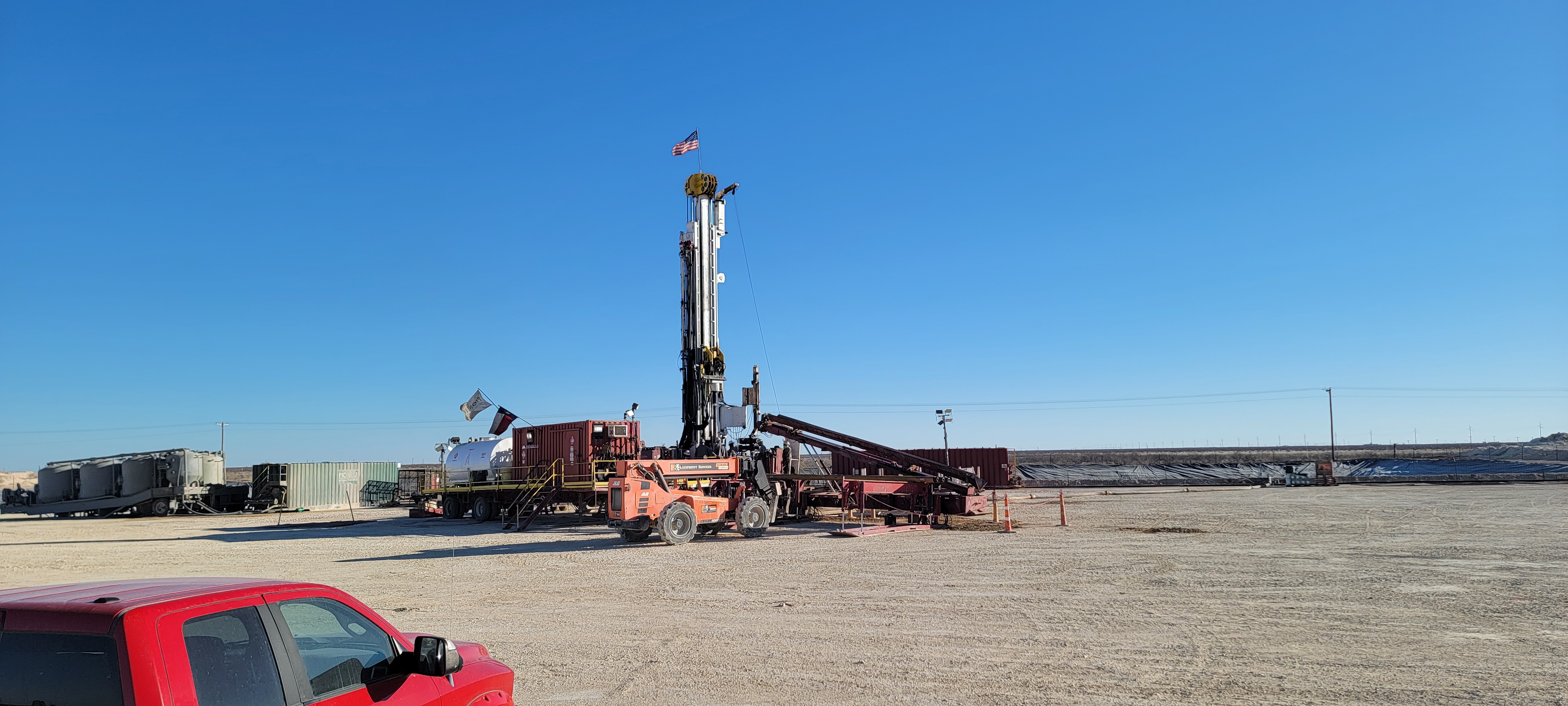 Wide view of drilling site with equipment